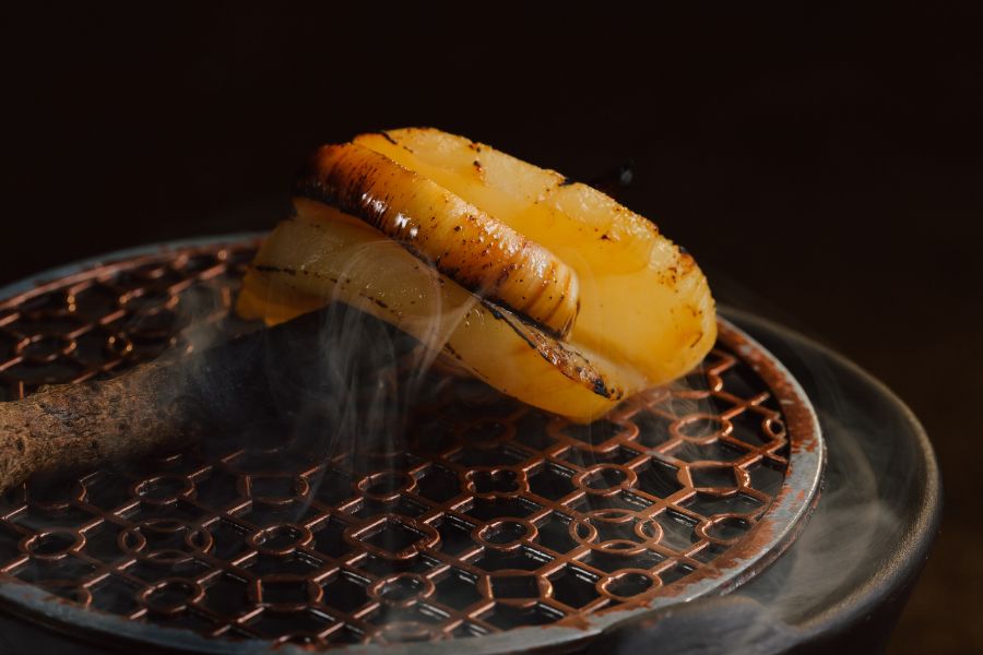 Each charred bite of coconut sparks Hanoi flavor memories.