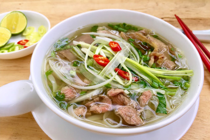 Bowl of Pho Hanoi with clear broth and sliced beef in Old Quarter