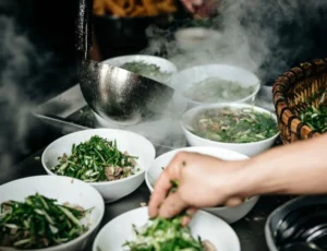 Eat Pho on the sidewalk like a local