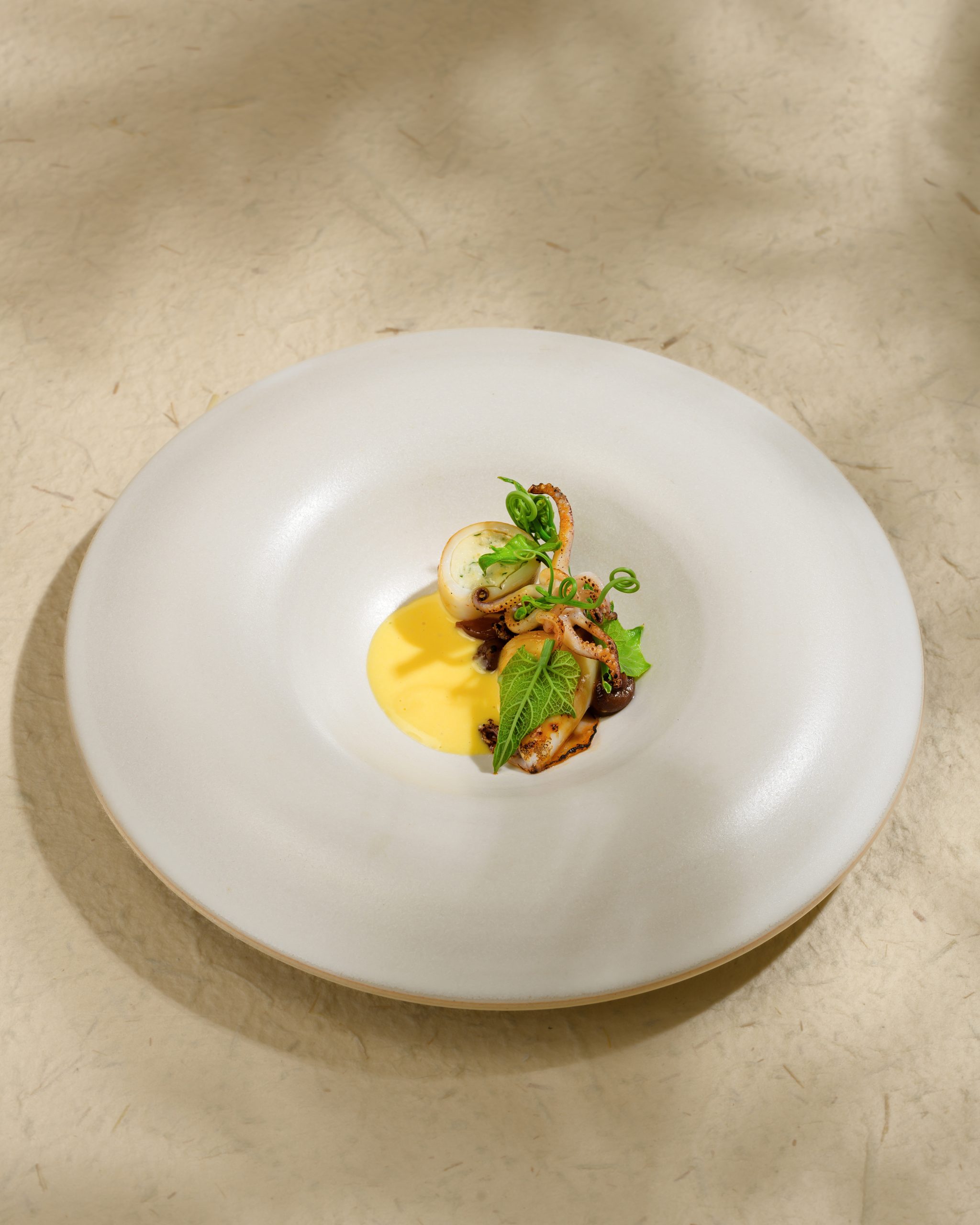 Baby Squid at Chapter Dining featuring a Vietnamese summer fine dining experience in Hanoi