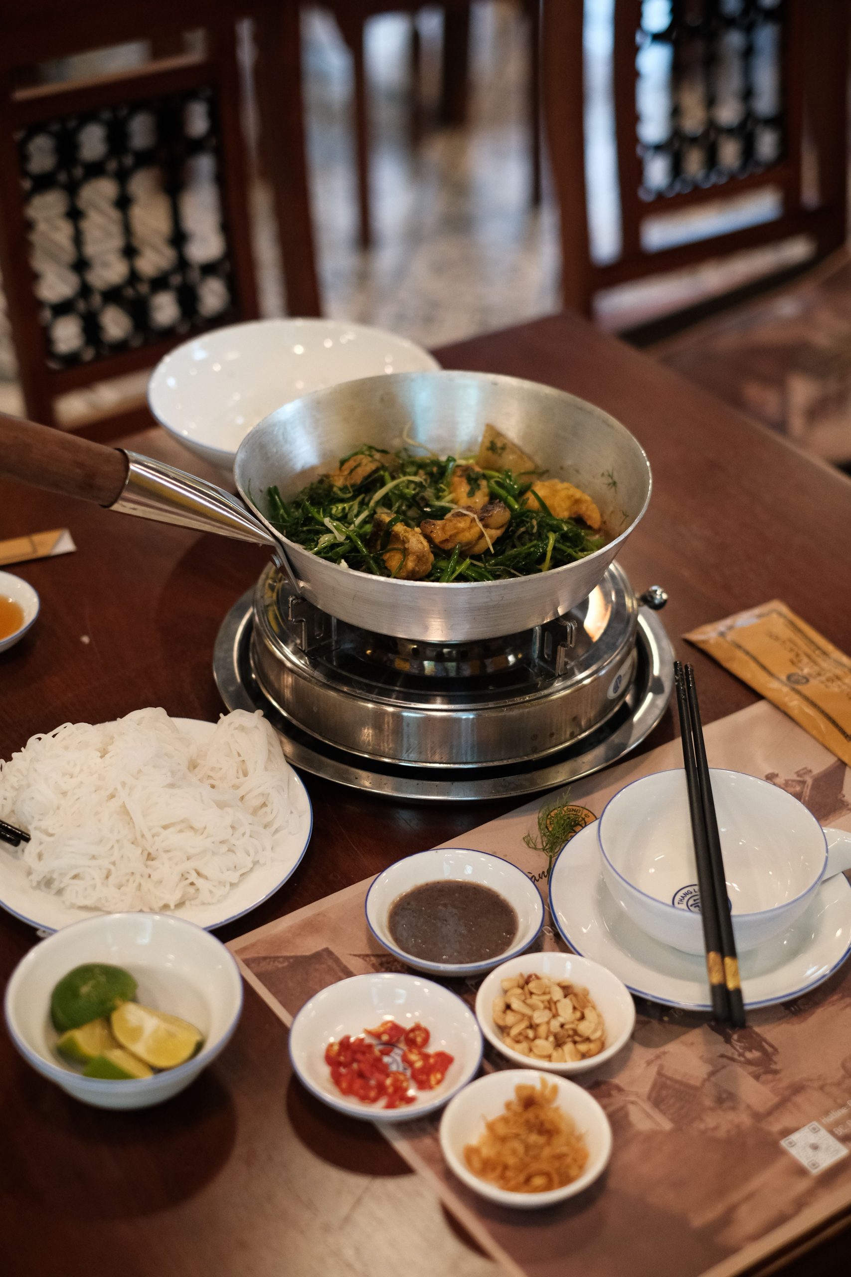 Traditional Northern Vietnamese cha ca served with mam tom dipping sauce