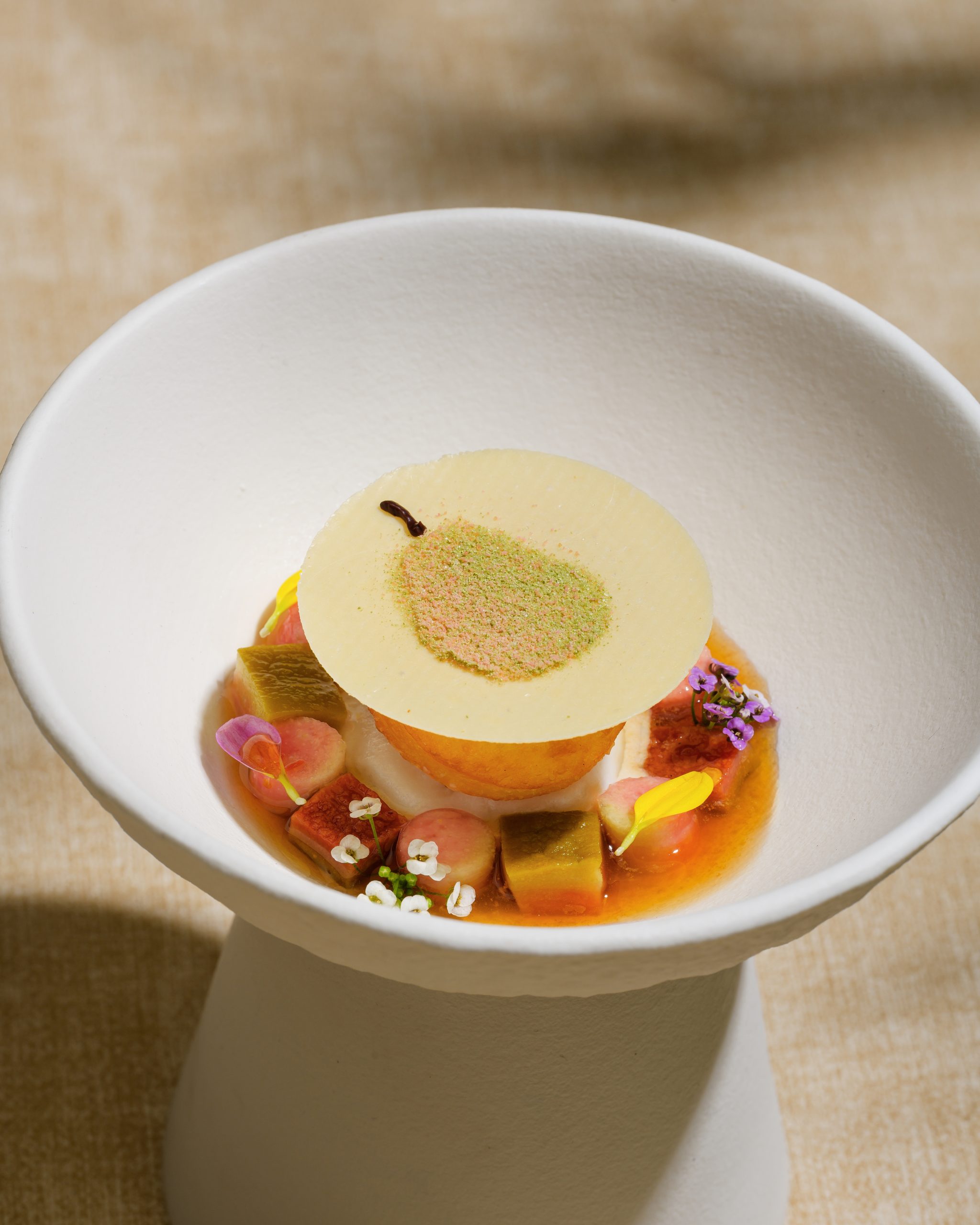 Pink guava black tea yogurt dessert at Chapter Dining's Lucent menu
