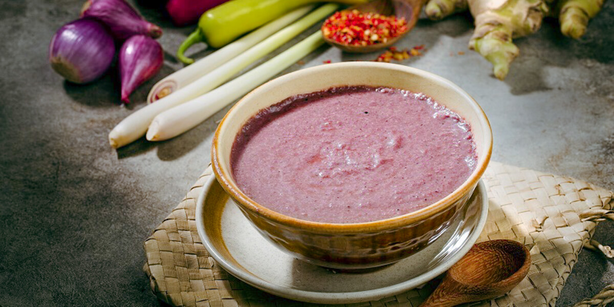 Vietnamese shrimp paste mam tom with its characteristic purple color and rich fermented aroma
