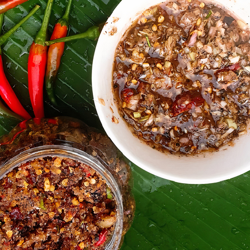 Cơm lam with mountain greens fresh herbs and chẩm chéo
