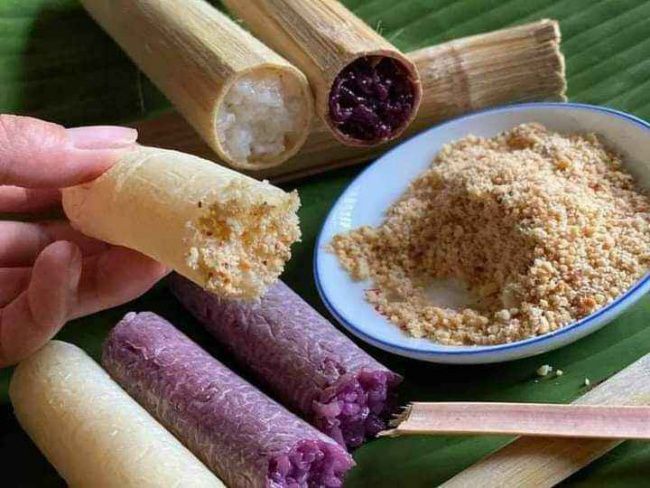 Cơm lam served with roasted sesame salt and crushed peanuts