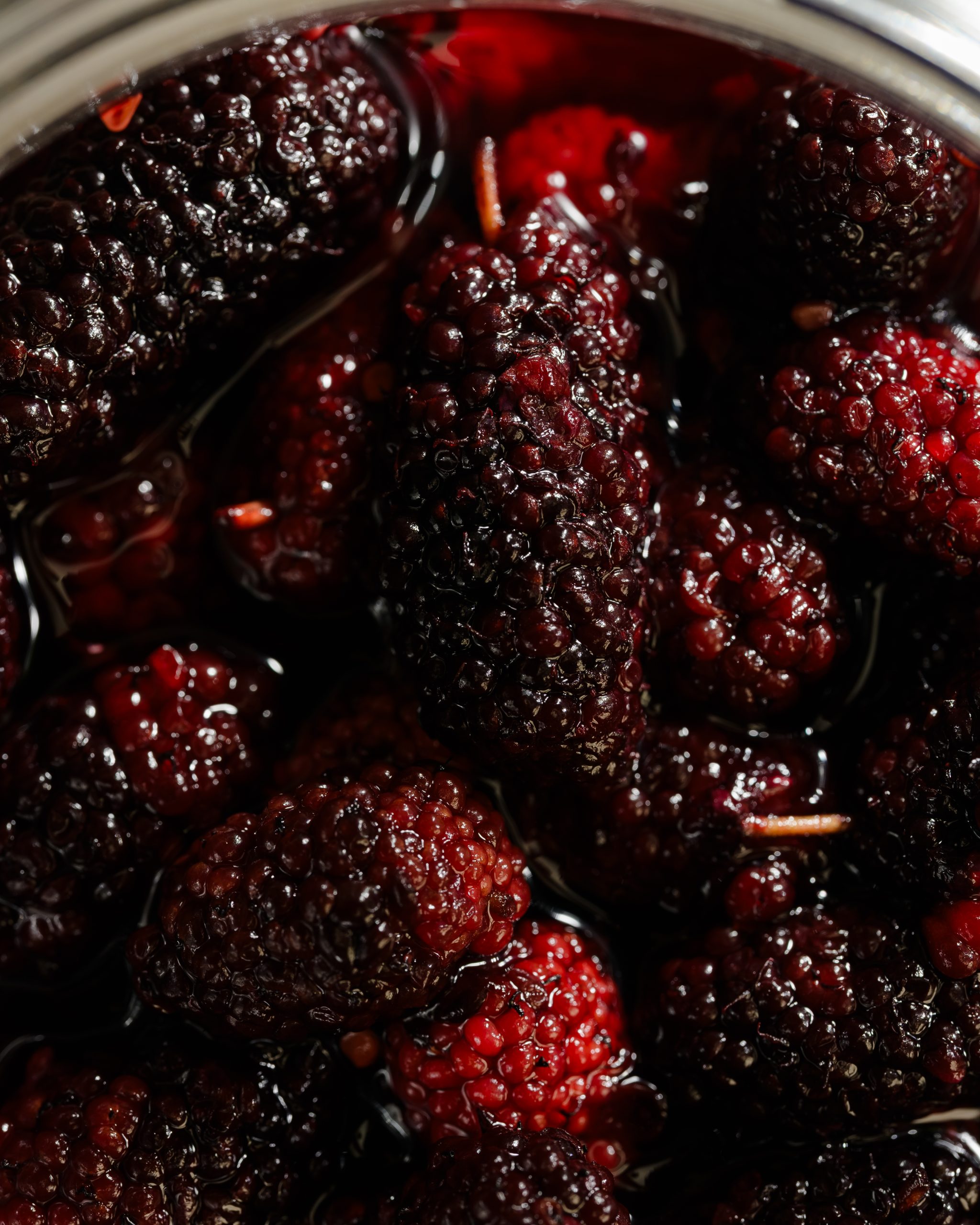 Ripe red and purple mulberries harvested during early summer in Hanoi