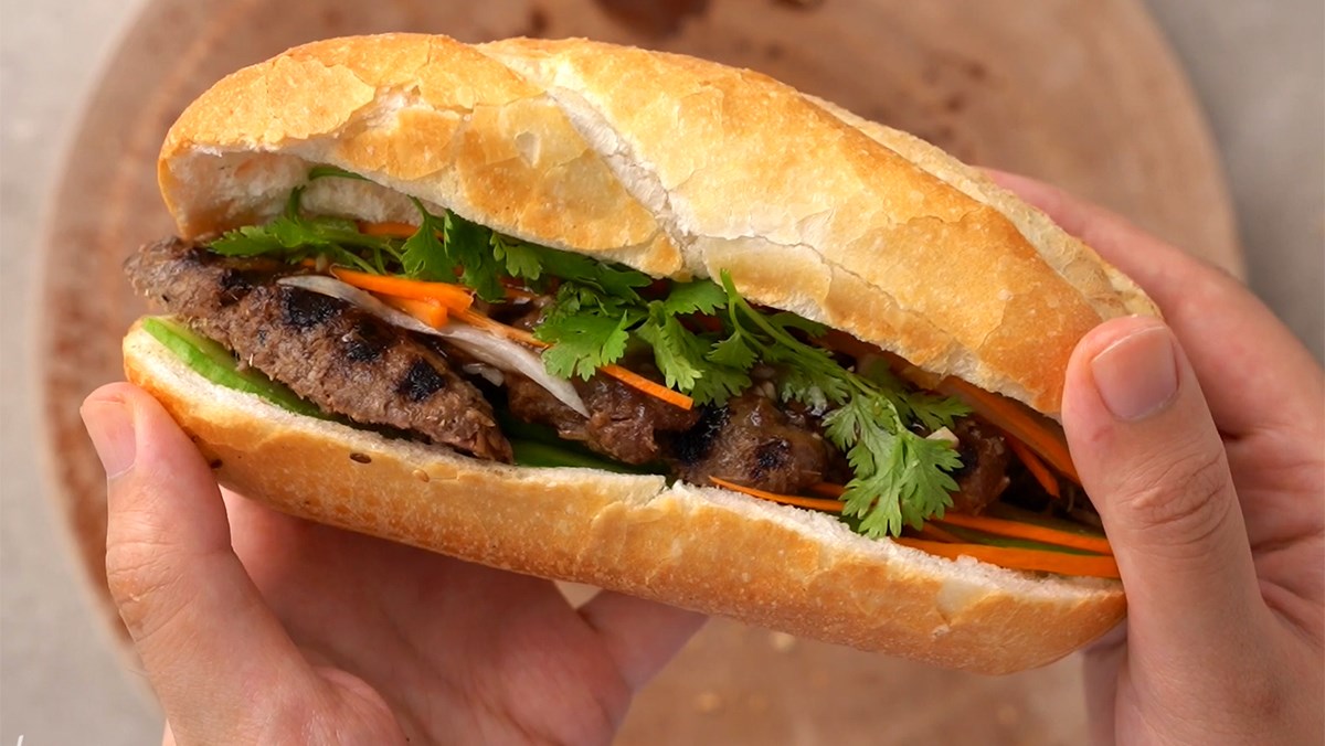 Hanoi-style Vietnamese banh mi with pâté, roasted pork, and fresh herbs