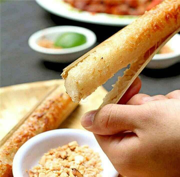 Cooked cơm lam revealed by peeling away the charred bamboo tube