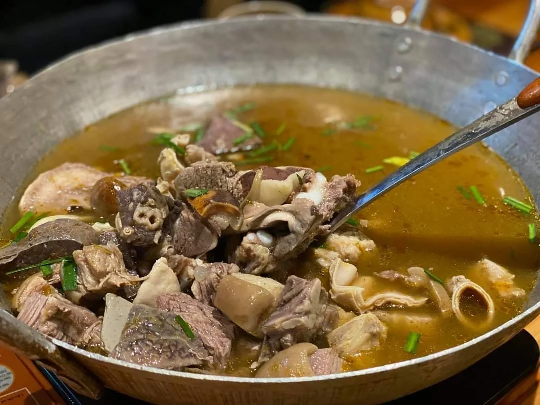 Traditional thắng cố highland stew served in Sa Pa