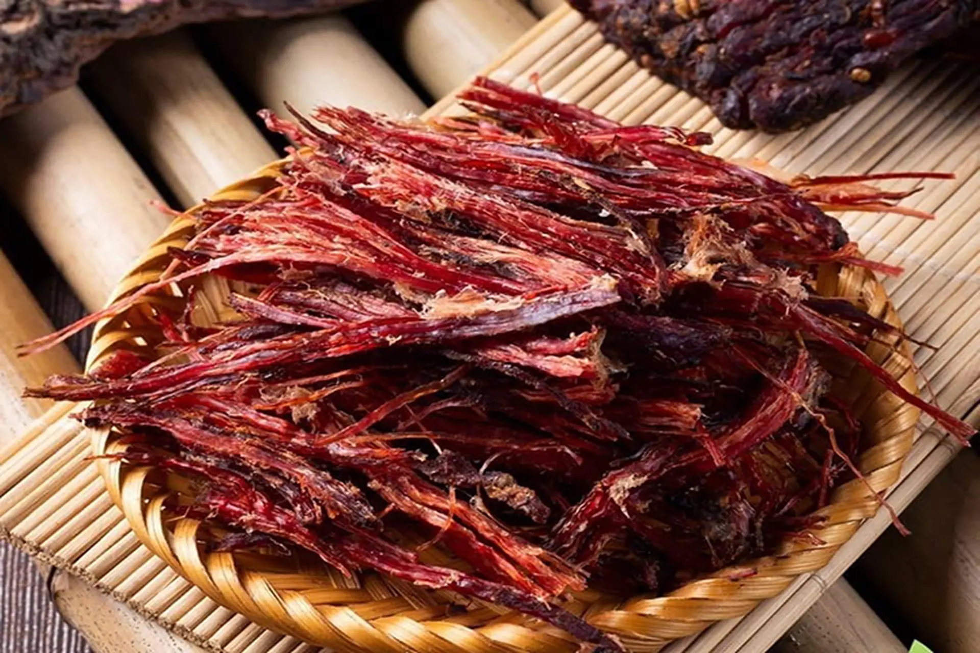 Smoked buffalo meat seasoned with mắc khén and dried above a hearth