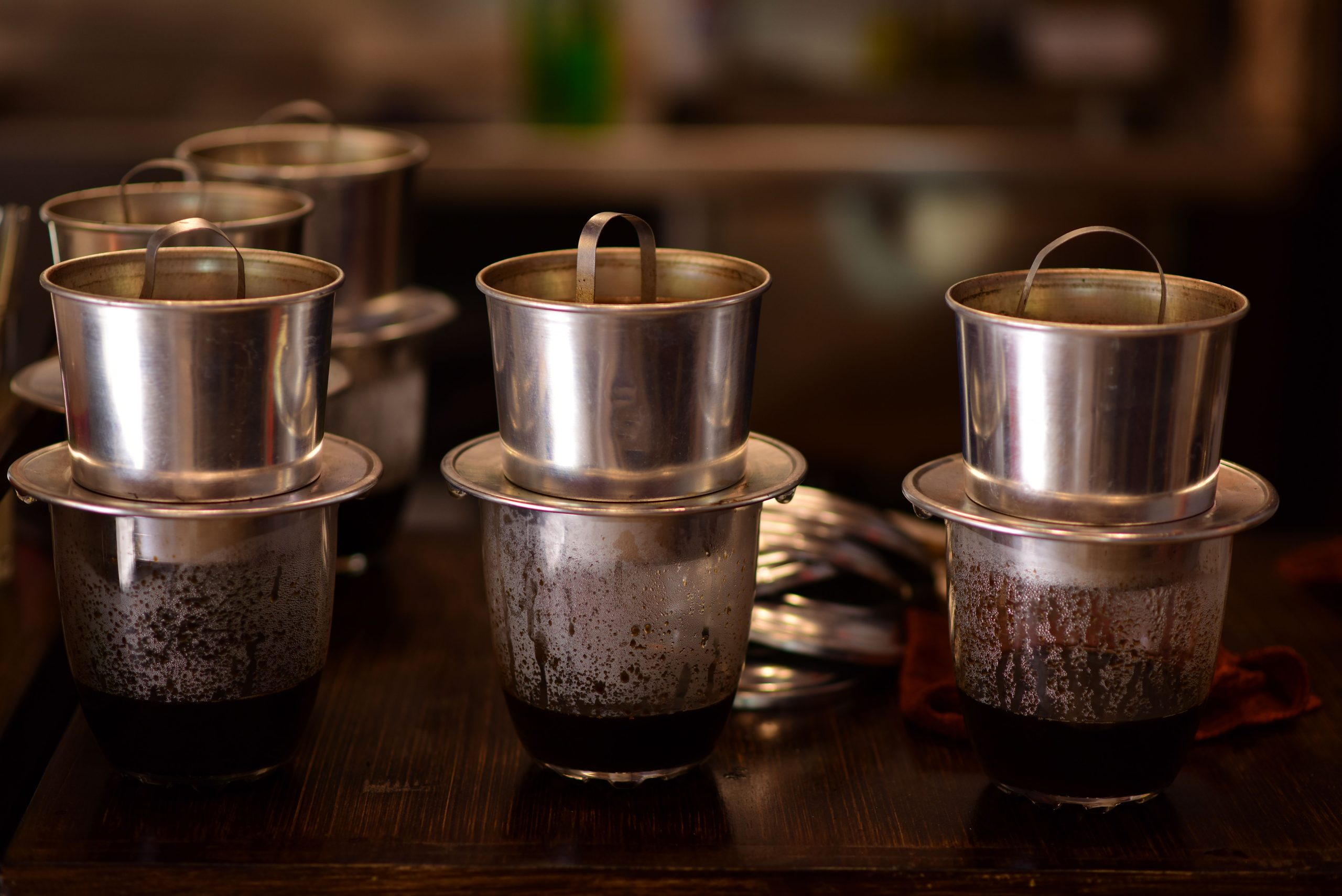 Vietnamese coffee served with a traditional metal phin filter in Hanoi