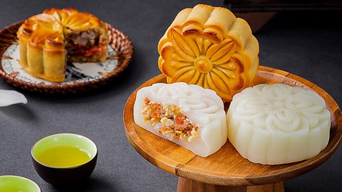 Baked bánh nướng and white sticky-rice bánh dẻo displayed side by side