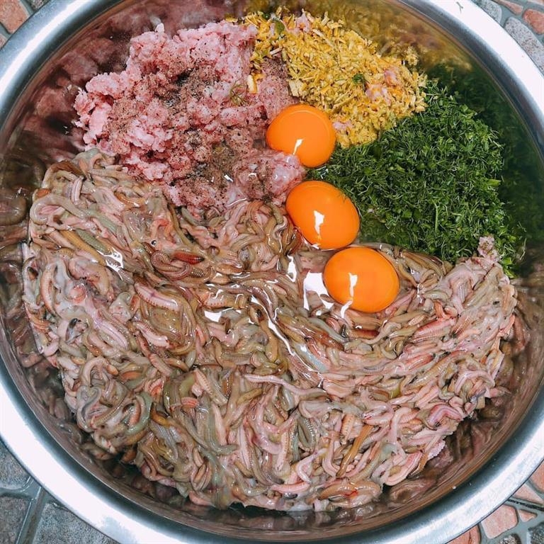 Cut-open chả rươi showing its crisp edge and soft rich centre
