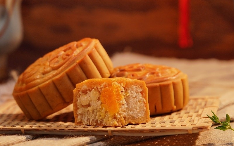 Baked Vietnamese mooncake filled with shredded coconut and salted egg yolk
