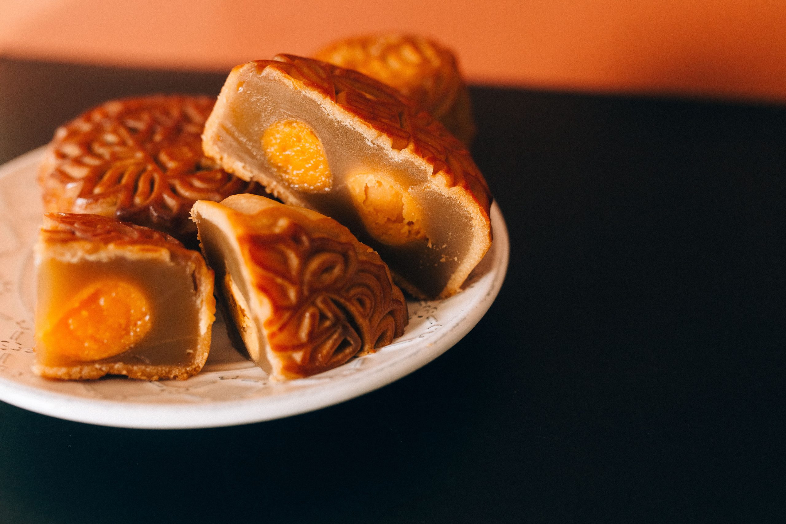 Vietnamese mooncake cut open to reveal a golden salted egg yolk centre