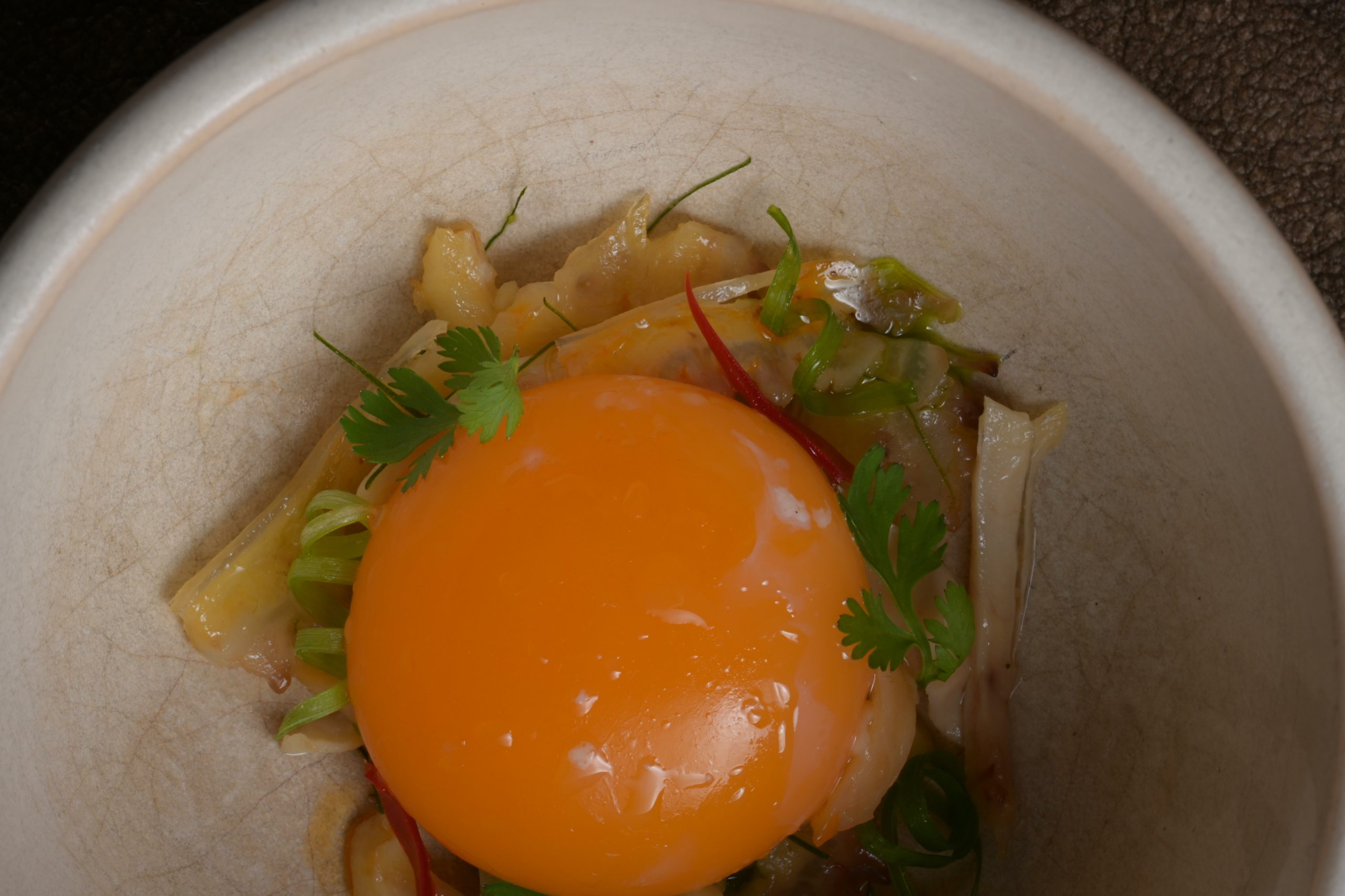 Pullet egg yolk confit at 63°C for Chapter’s chicken phở