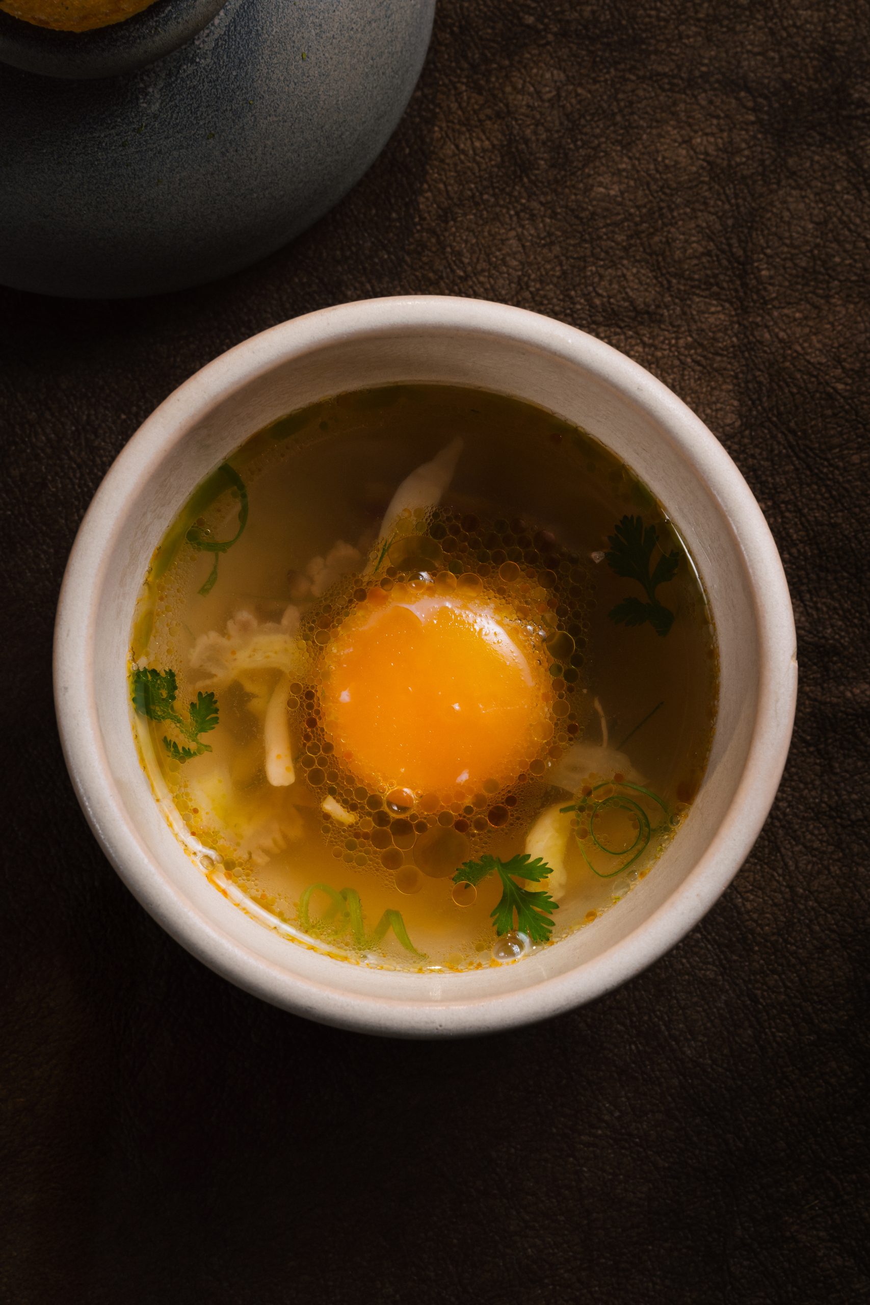 Chapter’s chicken phở course with confited egg yolk and Đông Tảo chicken feet