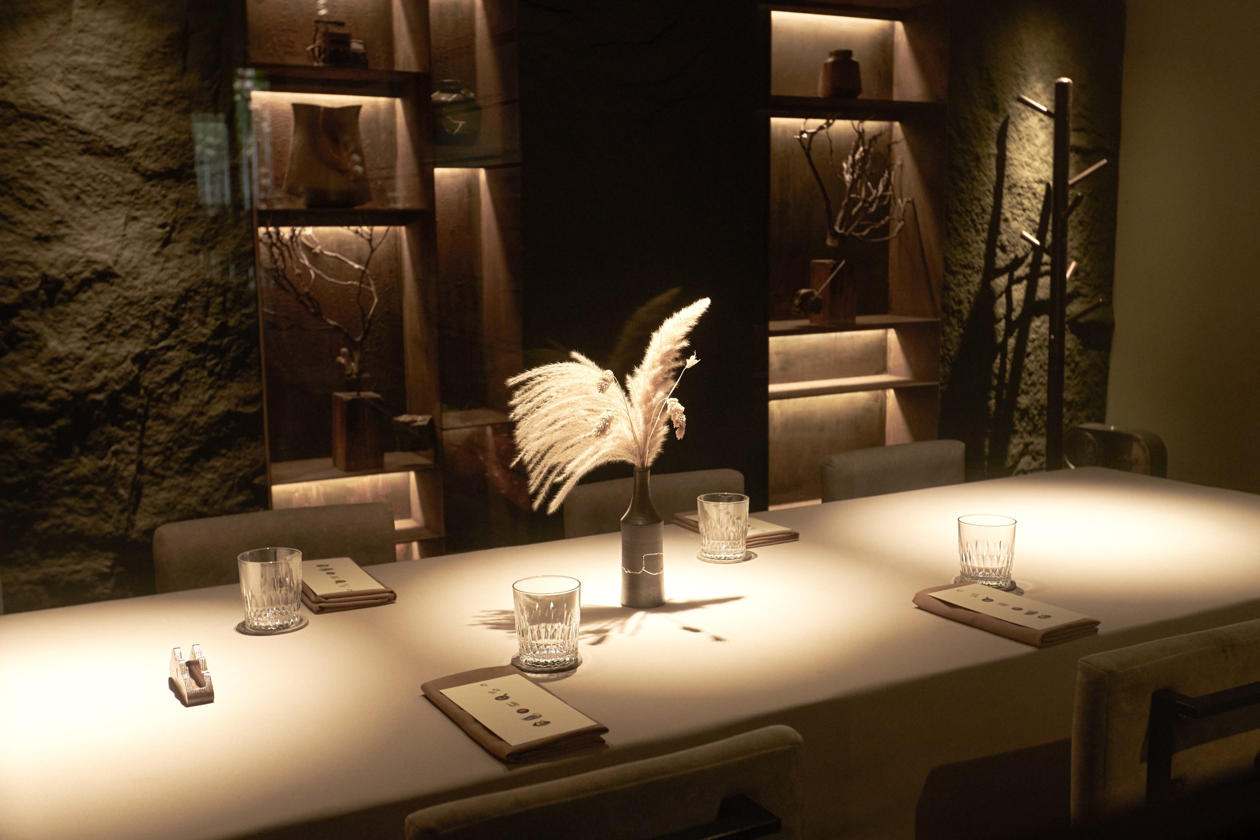 Guests watching chefs prepare the seasonal tasting menu in Chapter Dining’s open kitchen