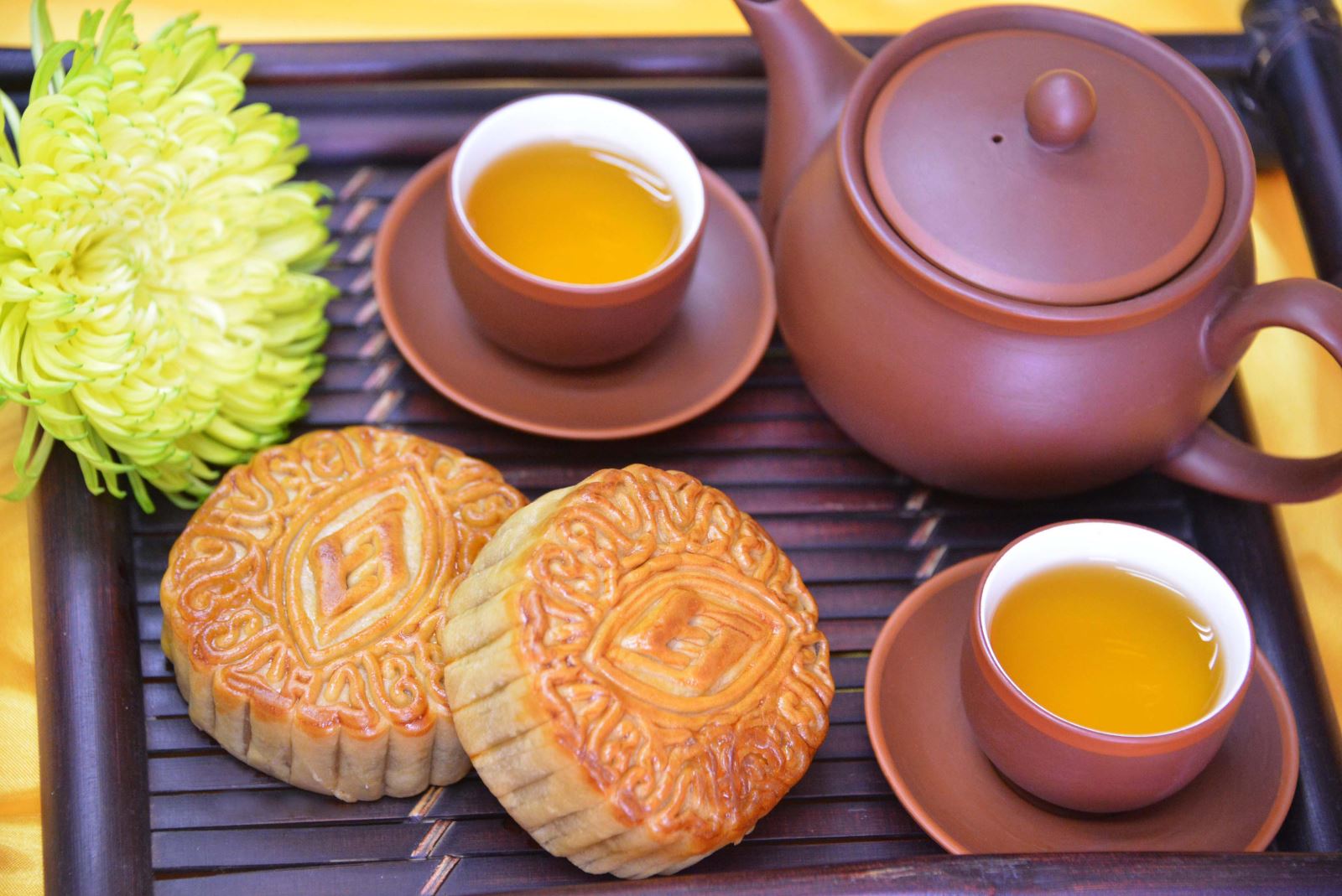 Vietnamese tea served with mooncakes, fresh cốm and autumn fruit in Hanoi