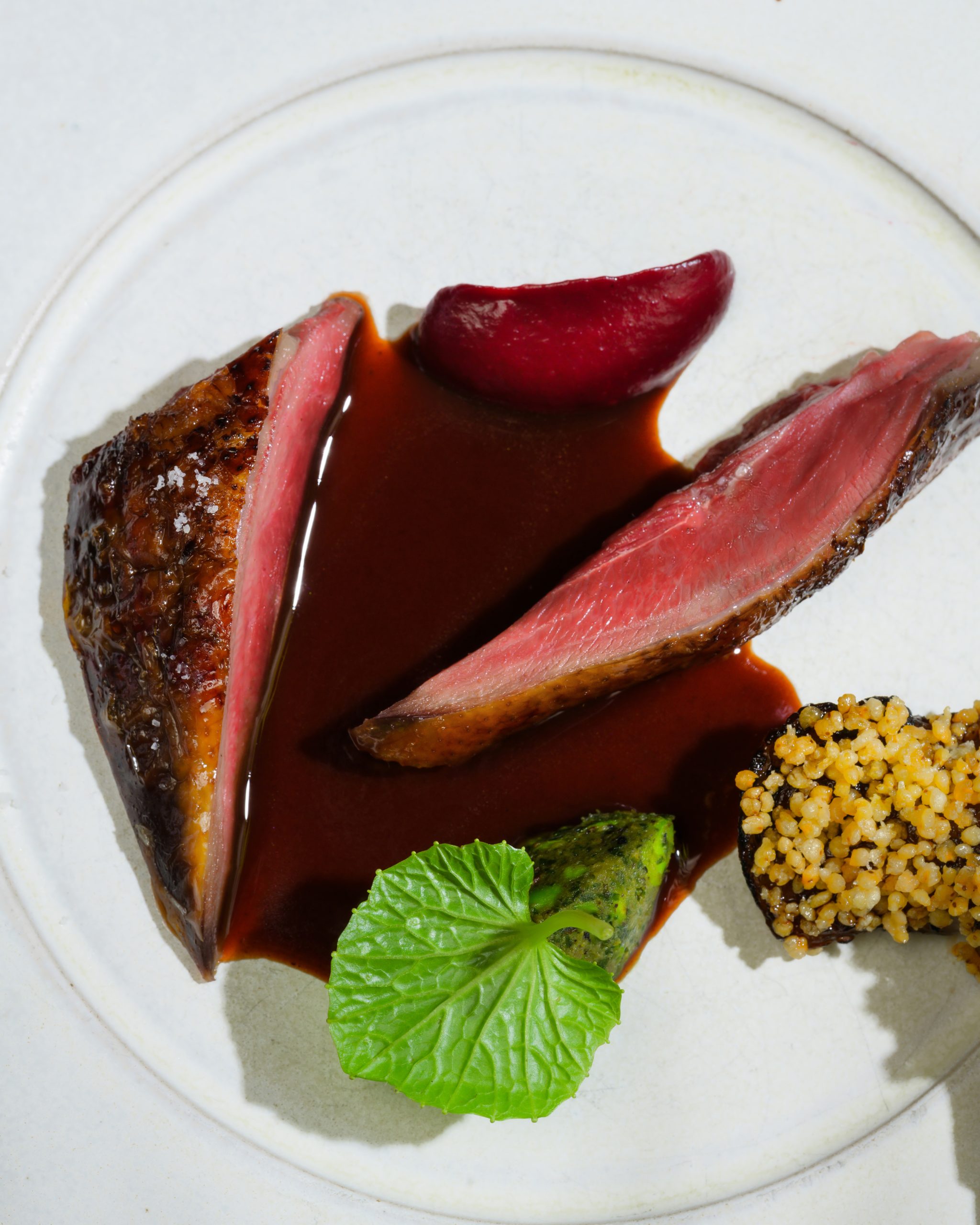 Wild duck with duck sausage and mắc mật served at Chapter Dining