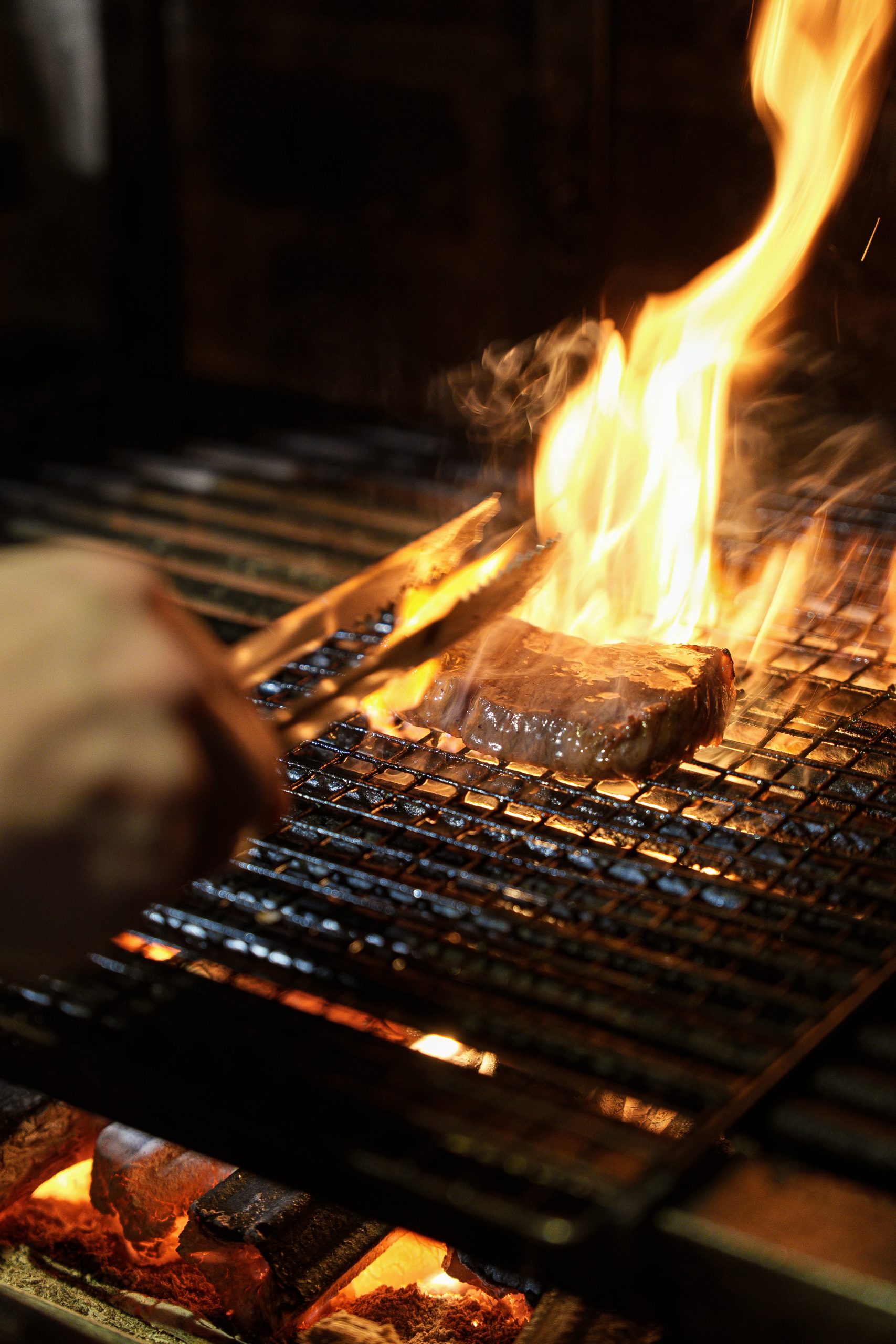 Charcoal grilling was a shared technique, from pork skewers to the beef course,  with a crisp crust and juicy interior 