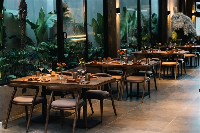 The high-ceilinged dining hall at BARBAK West Lake on Quảng An Street