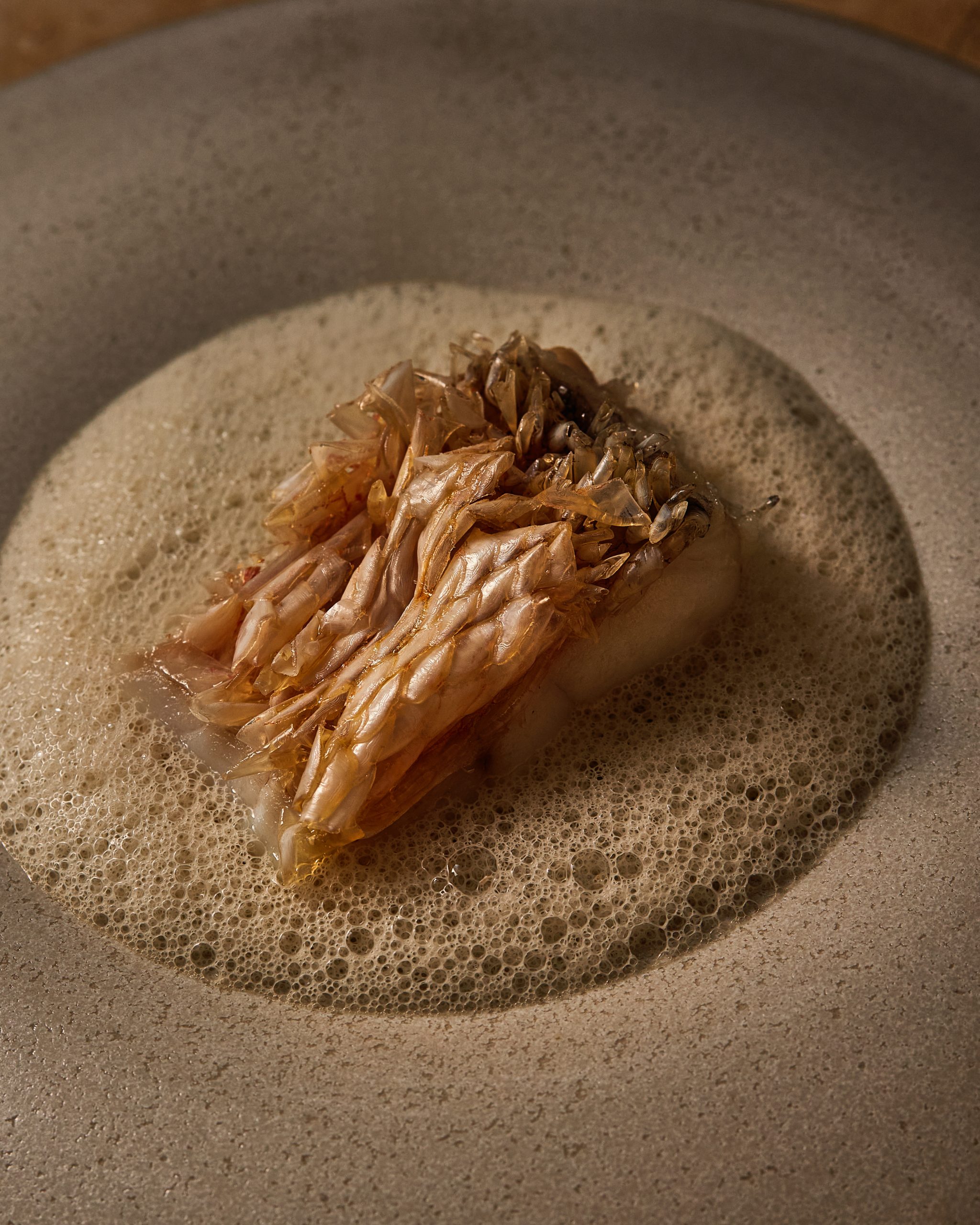 Close-up of seasonal fish served with tomato and dill at Chapter Dining.