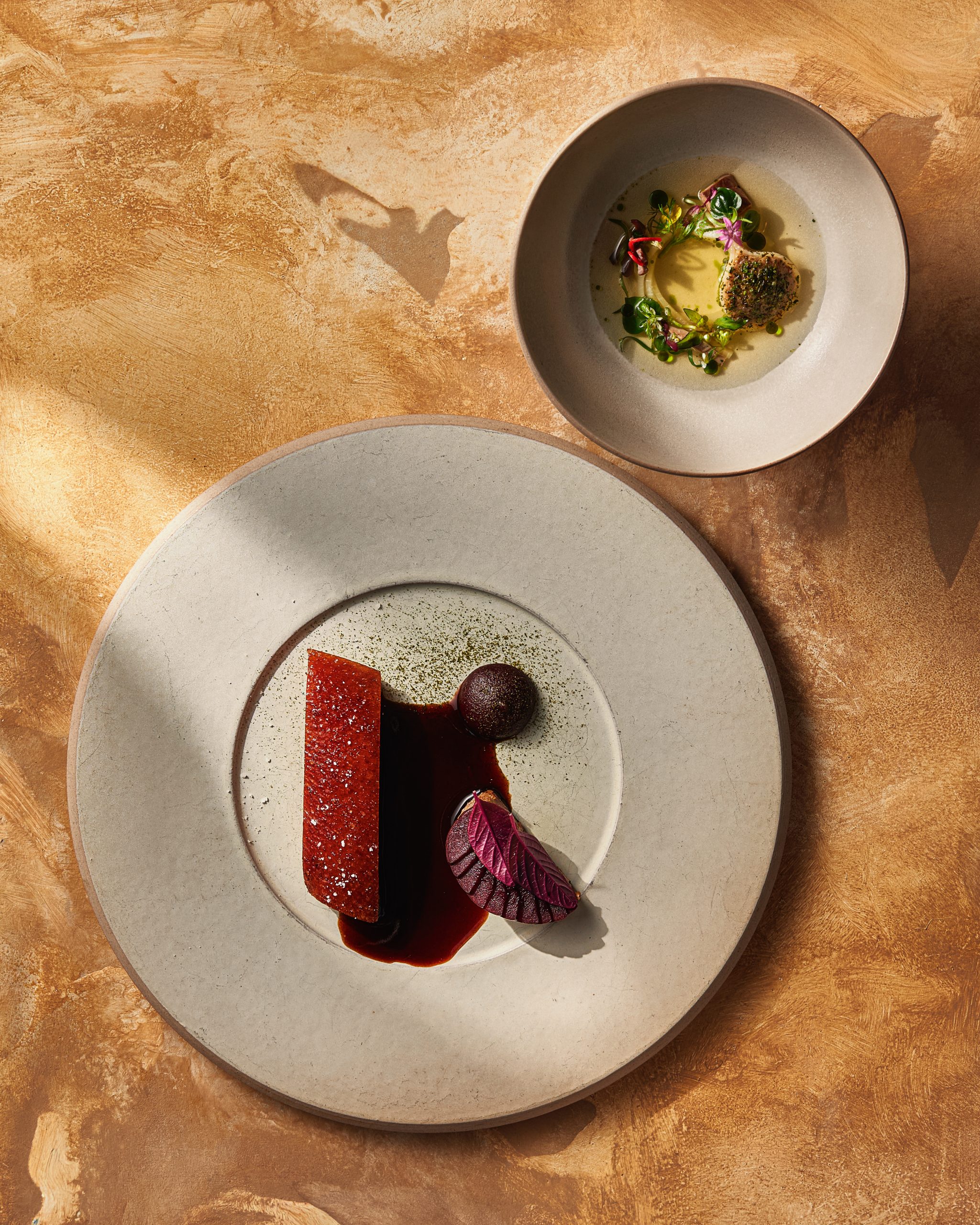 A Chapter Dining team member introducing a tasting menu course to guests