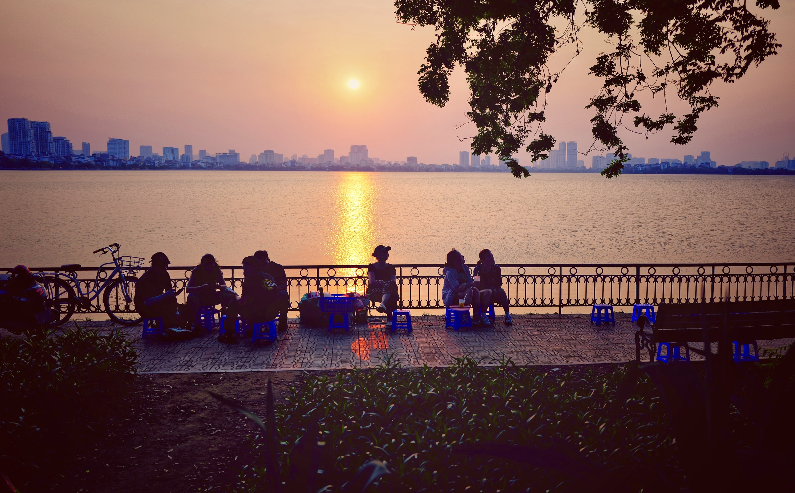 Mother enjoying elegant afternoon tea at Villa d'Eau West Lake for Vietnamese Women's Day Hanoi itinerary